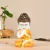 Polyresin  Praying Monk Buddha Statue ( White and Yellow)