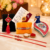 Craftam Rakhi Gifts for Brother Combo Set- Marble Pooja Chopra , Raksha Bandhan Greeting , Roli Rice Pack and 4 Rakhi ( For Bhaiya , Bhabi and 2 Kids)
